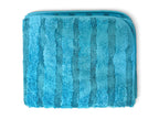 A folded blue terry cloth towel with vertical striped texture, shown on a plain white background.